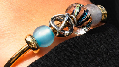 Round light blue agate and labradorite bead on a bangle with atom silver bead and glass bead